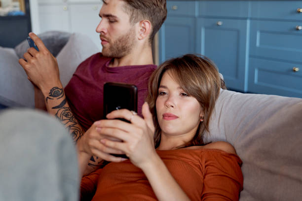 istock Bored couple spending time at home 1337431610