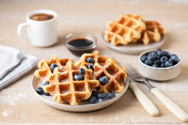 istock Breakfast belgian waffles with blueberries and cup of coffee 1337432207