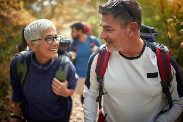istock An elderly couple walking through the woods 1337433417