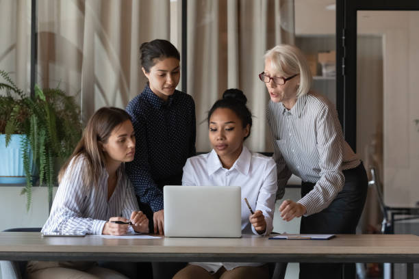 istock Diverse colleagues working on online project together, using laptop 1337433782