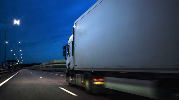 istock Truck on a highway in the night 1337435879
