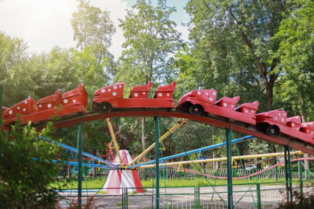 istock Old nostalgic attraction fun slides and cars. Toned background 1337436683