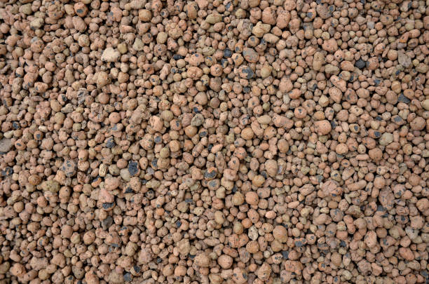 istock Lightweight expanded clay aggregate or expanded clay is a lightweight aggregate made by heating clay to around 1,200 °C in a rotary kiln. The yielding gases expand clay by thousands small bubbles 1337437402