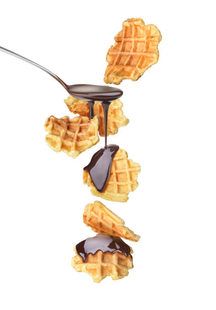waffles with chocolate in flight on a white background - waffle breakfast food sweet food imagens e fotografias de stock