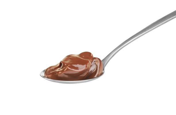 chocolate cream in spoon on white background - sweet sauce tablespoon food sweet food imagens e fotografias de stock