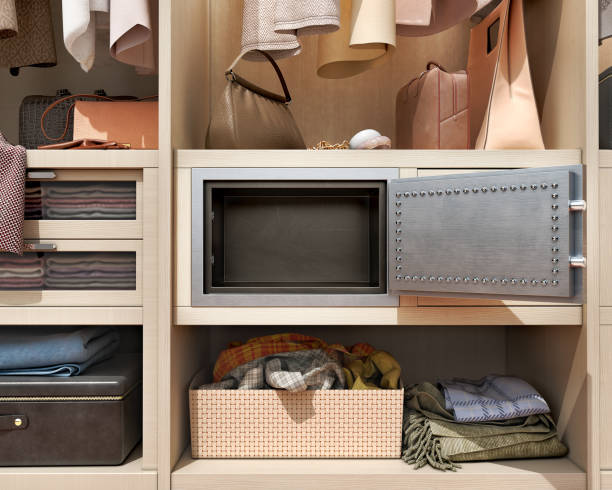 istock Front view on an opened empty small steel safe mounted in wardrobe, 3d illustration 1337438583