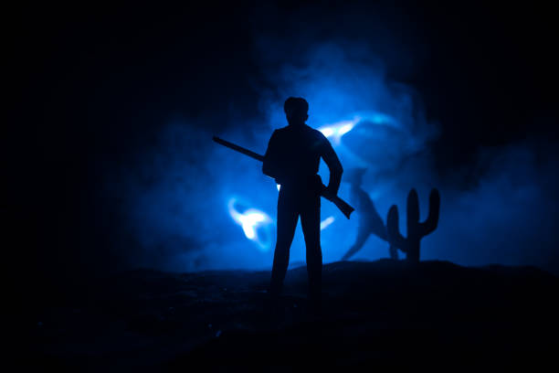 istock Western cowboy silhouette with texture at sunset and slivers of light 1337439557