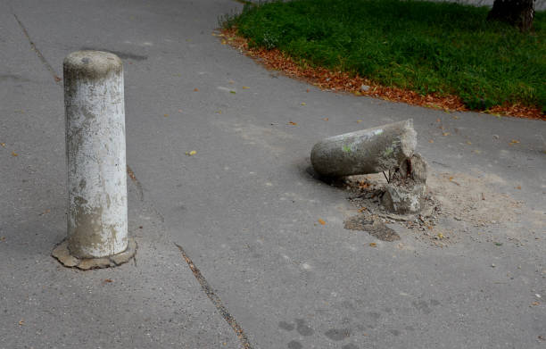 istock Van, the car crashed into a concrete pillar. the pillars stand in line, separating the pedestrian zone from the road. The skin is bent, the reinforcing wires are damaged. 1337442316
