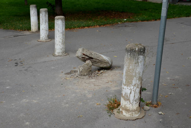 istock Van, the car crashed into a concrete pillar. the pillars stand in line, separating the pedestrian zone from the road. The skin is bent, the reinforcing wires are damaged. 1337442329