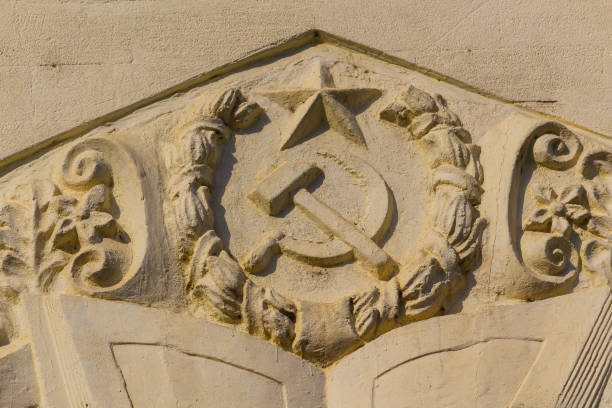 istock Typical USSR symbols are a sickle and a hammer on a building facade. 1337443901