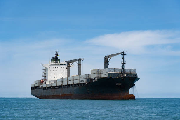 istock Cargo Container Ship at Sea with blue sky. Concept of logistics and transportation 1337443959
