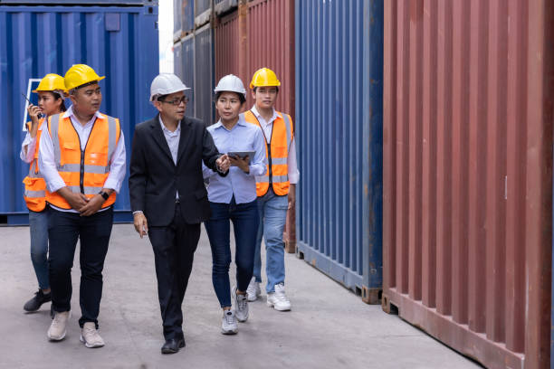 istock Engineer and foreman checking containers box from cargo, at warehouse in Thailand 1337444439