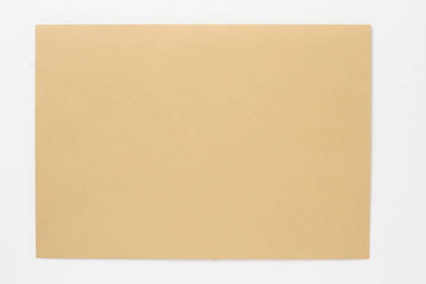 istock Classic paper envelope on a white wooden table. Blank space 1337444496