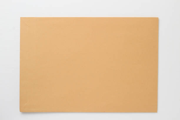 istock Classic paper envelope on a white wooden table. Blank space 1337444498