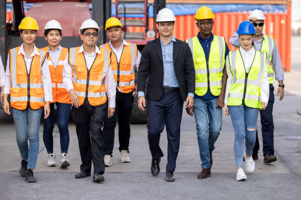 istock professional engineer and manager and foreman worker team walking in the container cargo site 1337444507