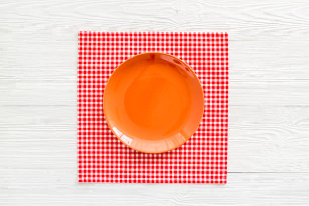 istock Top view of empty plate on napkin. Table setting for dinner 1337446042