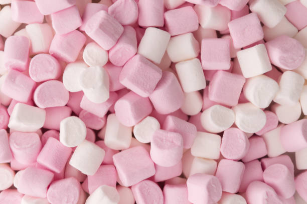 istock Pink and white marshmallow candy background texture 1337446195