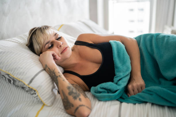 istock Woman sleeping on the bed at home 1337448247