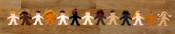 istock Multi-ethnic human paper chain banner with men and women 1337448941