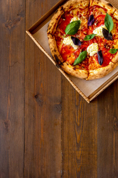 Italian pizza with tomatoes cheese and basil, top view