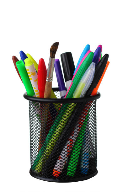 istock Clerical glass with pens and felt-tip pens on a white background 1337449463
