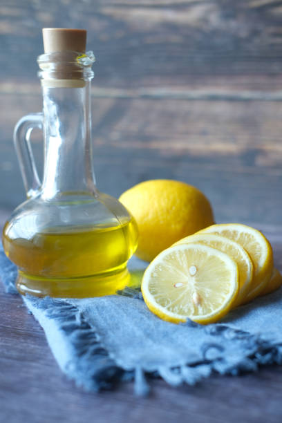 istock glass container of oil and lemon on table 1337450909