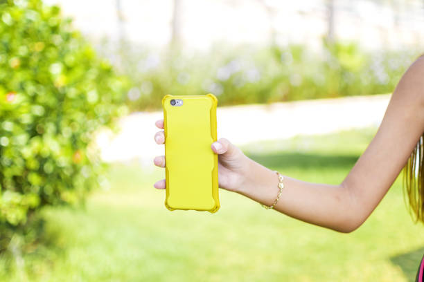 Little girl playing game with her mobile phone
