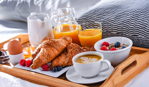istock A tray with breakfast on a bed in a hotel room 1337451015