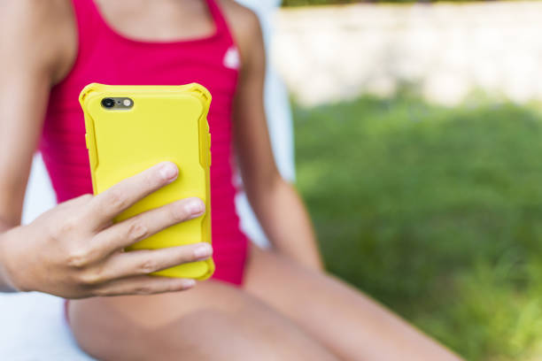 istock Little girl using mobile phone 1337453173
