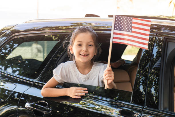 istock Girl Holding American Flag 1337453654