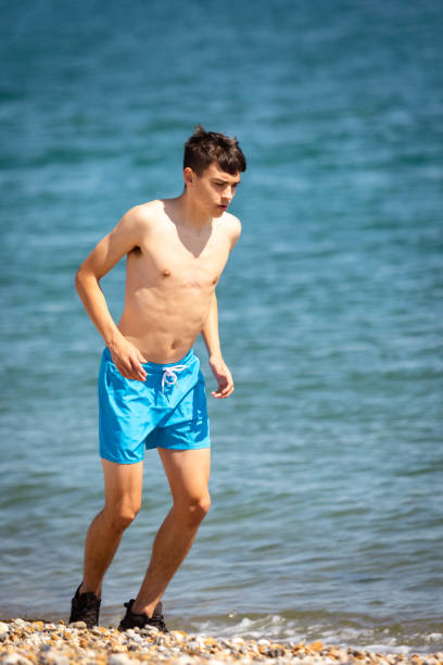 istock Running on a beach next to the sea 1337455332