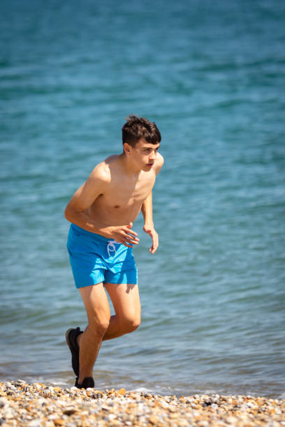 istock Running on a beach next to the sea 1337456277