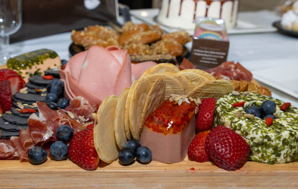 istock mixed food platter of biscuits salami berries strawberries ham biscuits 1337456289