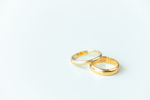 Wedding rings against white background.