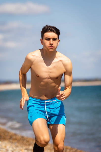 istock Running on a beach next to the sea 1337456452