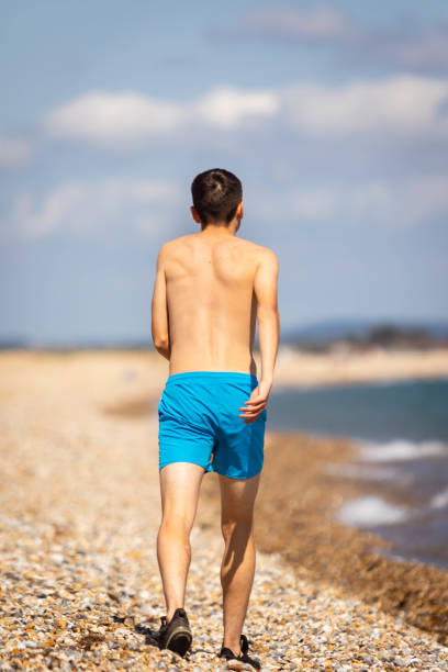 istock Running on a beach next to the sea 1337456467