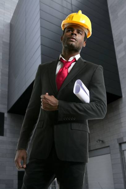 istock African american architect engineer yellow hardhat 1337459047