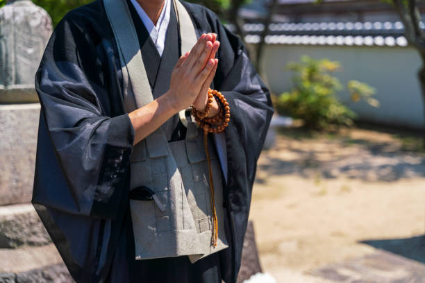 istock A monk praying in front of the tomb 1337459768