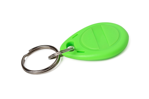 Plastic magnetic key fob on a ring isolated on white background