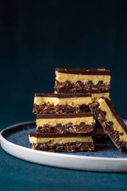 istock Nanaimo bars - a traditional Canadian dessert - on a dark background 1337465524