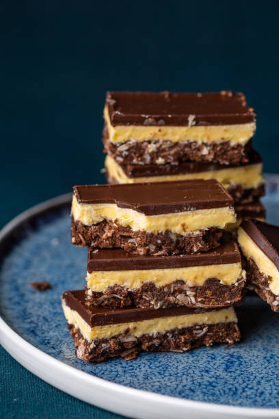 istock Nanaimo bars - a traditional Canadian dessert - on a dark background 1337465553