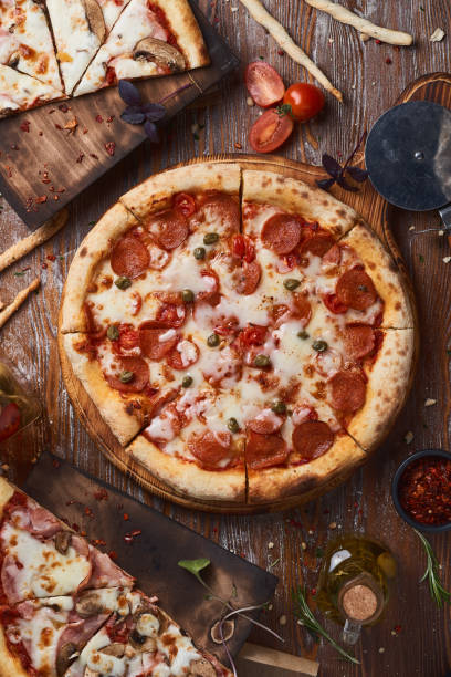 istock pizza top view on a wooden table 1337466354