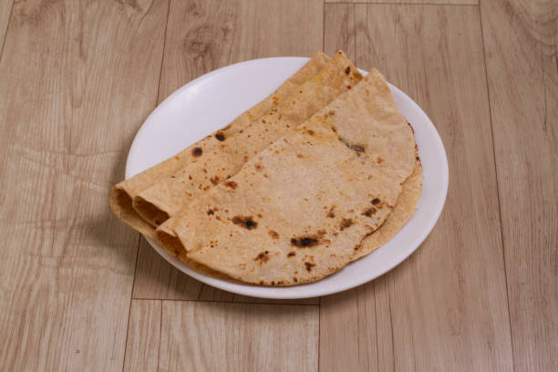 istock Indian Traditional Cuisine Chapati, Roti, Fulka, Indian Bread, Flatbread, Whole Wheat Flat Bread, Chapathi, Wheaten Flat Bread, Chapatti, or Chappathi 1337466497