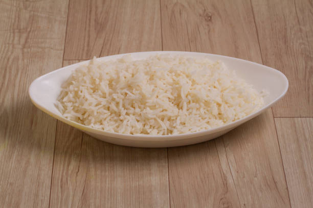 istock Cooked plain white basmati rice in bowl over wooden background 1337466580