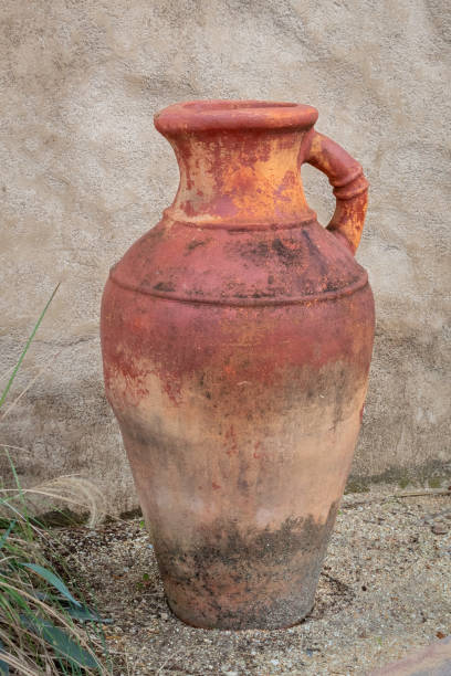istock Large Vintage Earthenware Terracotta Vase Next to a Villa 1337466702
