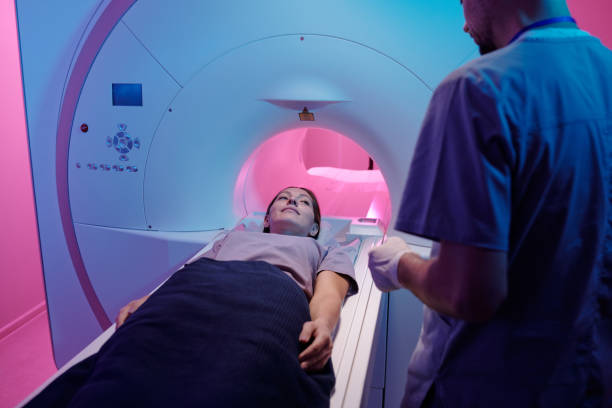 istock Young female patient looking at radiographer before medical diagnostics 1337470116