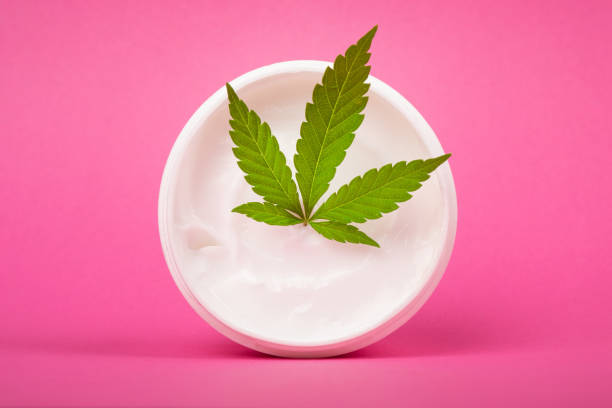 hemp cosmetic cream for skin care on pink background stock photo