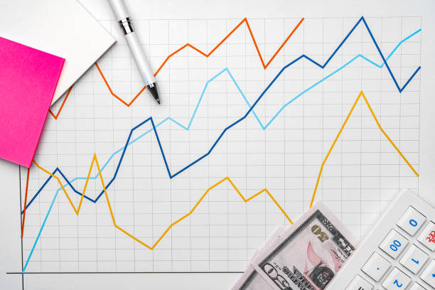 istock Office workplace table with report pages with financial data 1337471823