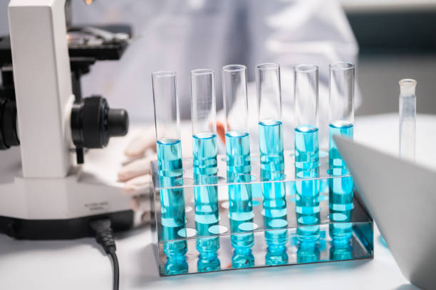 istock scientist looking through scientific microscope lense in laboratory, scientist doing research in term of medicine biotechnology biology or chemistry, doctor analyzing work in medical microbiology lab 1337473277