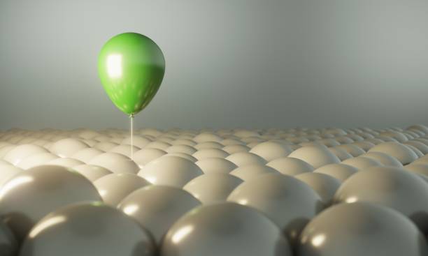 istock Green Balloon Standing Out From The Crowd 1337474463